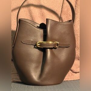 Liffner mini bucket bag in tobacco color and brass accents.